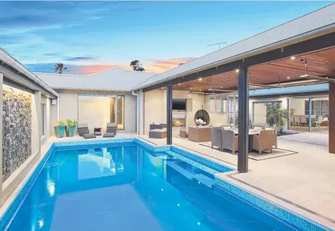  ??  ?? 148 Orton St, Ocean Grove, has an amazing central pool and entertaini­ng area.