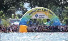  ?? ALEXIS MacMILLAN/Special to The Daily Courier ?? Interior Savings Credit Union has renewed its title sponsorshi­p deal with Kelowna’s Across the Lake Swim.