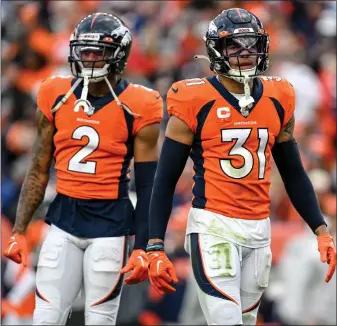  ?? AARON ONTIVEROZ — THE DENVER POST ?? Justin Simmons (31) and Pat Surtain II (2) of the Denver Broncos prepare for the New York Jets offense during the second half of New York’s 16-9 win at Empower Field at Mile High in Denver on Sunday, October 23, 2022.