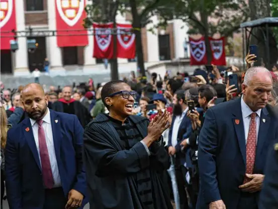  ?? SUZANNE KREITER/GLOBE STAFF ?? Claudine Gay walked through Harvard Yard, where she was inaugurate­d Friday as Harvard University’s 30th president.