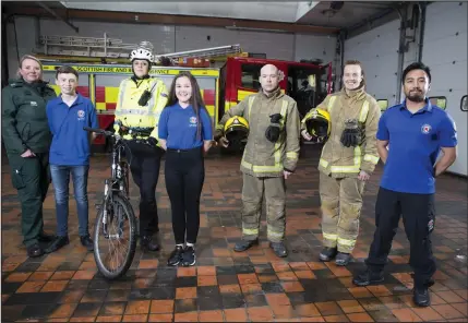  ??  ?? Devlin O’Neill, Molly O’Donnelly and Arron Fernandez with June Maxwell, of the Scottish Ambulance Service, firefighte­rs Lauren McGregor and Stuart Lonie, and police officer Catriona Kerr at the launch. Below, young First Aiders Abbie Moldoon and Devlin...