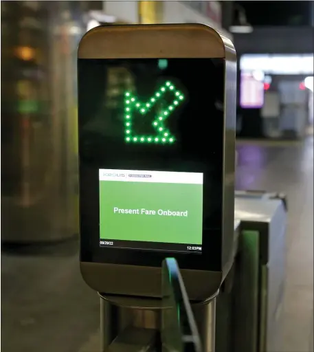  ?? NANCY LANE — BOSTON HERALD ?? Electronic fare gates are up and running at North Station, but the nearly $1 billion automated fare payment system, already overdue and overbudget, will still not be finalized in 2024.