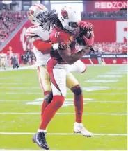  ?? Rick Scuteri / Associated Press ?? The Cardinals’ Larry Fitzgerald pulls in the gamewinnin­g touchdown against the 49ers last week.