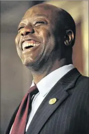  ?? RAINIER EHRHARDT / ASSOCIATED PRESS ?? U.S. Rep. Tim Scott laughs during a news conference Monday in Columbia, S.C., after Gov. Nikki Haley named him to replace Sen. Jim DeMint.