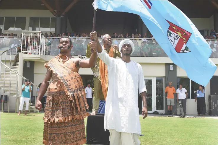  ?? ITaukei Photo: Ronald Kumar ?? Dan Fox (left), and Sadrishan Velaidan depict two cultures coming together under one banner, Girmitiyas and during the opening of the Girmit Centennial celebratio­ns at Albert Park in Suva on November 9, 2016.