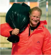  ??  ?? Passmore arrives at Edinburgh airport after being rescued from his capsized catamaran