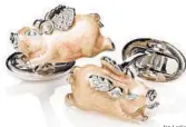  ?? Jan Leslie ?? Jan Leslie The designer’s signature whimsical flying pig cuff links are crafted in sterling silver and handpainte­d pink enamel. Also available in lime green. $450. Available at janleslie.com.
