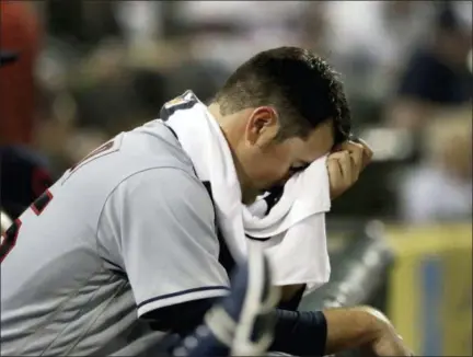  ?? CHARLES REX ARBOGAST — ASSOCIATED PRESS ?? Adam Plutko rests on the dugout rail after being pulled in the fifth inning against the White Sox on June 12 in Chicago.