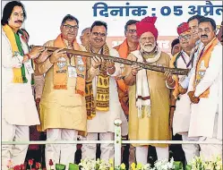  ?? PTI ?? Prime Minister Narendra Modi being presented a memento during a public meeting ahead of Lok Sabha elections, in Churu on Friday.