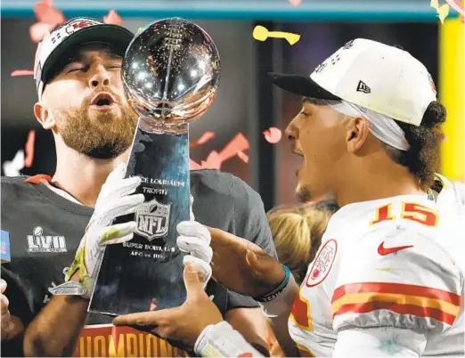  ?? MARCIO J. SANCHEZ AP ?? Kansas City Chiefs tight end Travis Kelce (left) and quarterbac­k Patrick Mahomes hold Vince Lombardi Trophy after defeating Philadelph­ia in the Super Bowl.