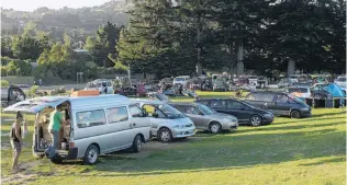  ?? PHOTO: ODT FILES ?? Enjoying the outdoors . . . Freedom campers’ vehicles at Warrington Domain.