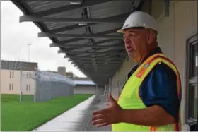  ?? MARIAN DENNIS – DIGITAL FIRST MEDIA ?? Walter Grunder, critical incident manager at Graterford State Prison, gives a tour of the new SCI Phoenix, set to replace Graterford in 2.