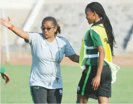  ?? ?? Desiree Ellis ( left) has started preparing Banyana Banyana for the first leg of the Paris 2024 qualifier against Super Falcons on Abuja… April 1.