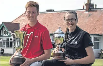  ?? Picture: Scottish Golf. ?? Champions Greg Dalziel and Hannah Darling with their trophies.