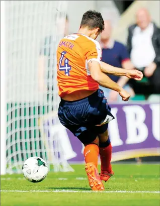  ??  ?? EASY DOES IT: Jonathan Smith slots home Luton’s third