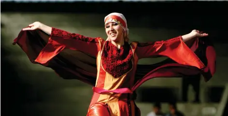  ?? THE ASSOCIATED PRESS ?? The thobe, a brightly embroidere­d robe for women, has long been a staple of Palestinia­n culture.