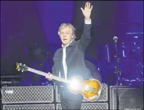  ?? John Katsilomet­es Las Vegas Review-Journal @JohnnyKats ?? Paul McCartney performs Friday at T-Mobile Arena. The musical legend had two shows in Las Vegas this weekend.