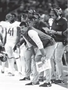  ?? AP PHOTO/MICHAEL AINSWORTH ?? Tennessee Titans coach Mike Vrabel watches play against the Dallas Cowboys on Monday in Arlington, Texas. Vrabel faces his former team and coach as the Titans play the Patriots today in Nashville.