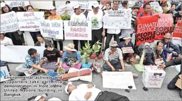  ??  ?? Environmen­tal activists and supporters take part in a demonstrat­ion in front of the United Nations building in Bangkok.