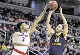  ?? BEN MARGOT / AP ?? West Virginia’s Nathan Adrian shoots over Gonzaga forward Johnathan Williams during the first half of Thursday’s West Regional semifinal. The Bulldogs won 61-58.