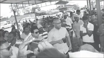  ??  ?? Opposition Leader Bharrat Jagdeo (centre in foreground) meeting with affected residents in Suriname.