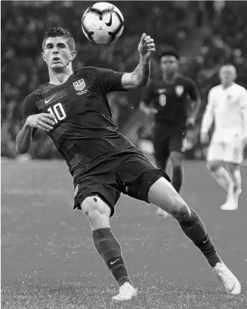  ?? MIKE HEWITT/GETTY ?? U.S. forward Christian Pulisic tries to control the ball in Thursday’s internatio­nal friendly at London’s Wembley Stadium.