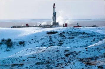  ?? @IMartensHe­rald Herald photo by Ian Martens ?? Drilling operations continue Monday afternoon at an existing well site within city limits just west of Cottonwood Park. Tamarack Valley Energy filed a notice in October of their intention to drill but city council was only informed on Monday.