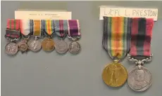  ??  ?? Veterans’ medals hang from a piece of cardboard, just some of the items found during the cleanout of the third floor of the legion building. The medals at left belonged to Major J. E. Wilkinson and the medals at right belonged to Lance Cpl. Lewis Preston. Preston was born in Yorkshire, England and died of his wounds on Sept. 11, 1917. Photo by Jason G. Antonio