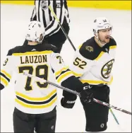  ?? Nam Y. Huh / Associated Press ?? Boston Bruins center Sean Kuraly, right, celebrates with defenseman Jeremy Lauzon after scoring in the second period on Wednesday.