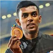  ??  ?? Satisfied: Royson Vincent clocked 1:52.52 to win gold in the men’s 800m.