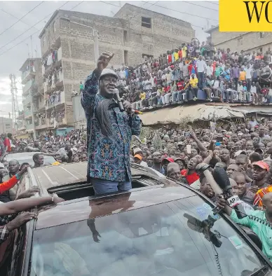  ?? BEN CURTIS / THE ASSOCIATED PRESS ?? Kenyan opposition leader Raila Odinga, speaking to supporters in Nairobi on Sunday, condemned police killings of rioters during protests following the country’s disputed election and is urging supporters to skip work Monday.