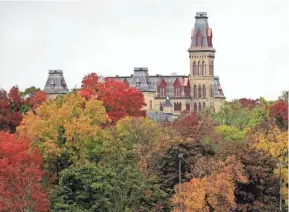  ?? MIKE DE SISTI / MILWAUKEE JOURNAL SENTINEL ?? Old Main hall is surrounded in a colorful canopy of fall-colored trees in the Soldiers Home district located in the Zablocki Veterans Affairs Medical Center on Oct. 12, 2020.