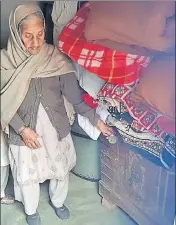  ?? HT PHOTO ?? Gurdayal Kaur stands next to the wooden box in which she has kept the body of her grandson at Hathur village near Jagraon on Tuesday.