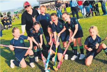  ??  ?? ABOVE: Hockey is alive and well at Greenwood Bay, with successful tours and matches, along with big smiles from participan­ts.