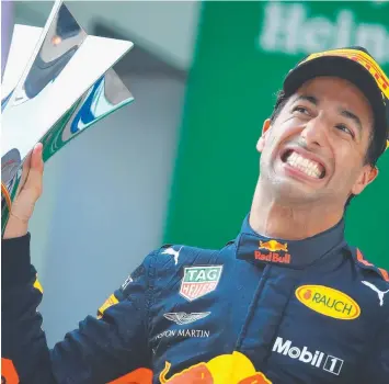  ?? Picture: CLIVE MASON/GETTY ?? WAITING: Daniel Ricciardo on the podium in Shanghai on Sunday.