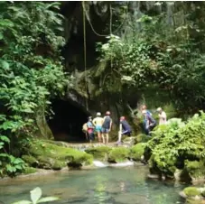  ?? BELIZE TOURISM BOARD ?? A hike through a tropical jungle leads to Actun Tunichil Muknal cave.