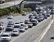  ?? DOUG DURAN — BAY AREA NEWS GROUP ?? Eastbound Highway 24commuter traffic, right, travels next to North bound Highway 680traffic before merging in Walnut Creek on March 20, 2019.