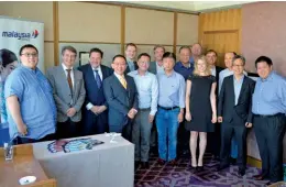  ??  ?? Left: Business Traveller Asia-Pacific readers pose for a group photo with Malaysia Airlines’ CCO Paul Simmons (third from left) and senior vice president, China, Joshua Law (fourth from left) Right: Engaging in a lively debate over lunch at the Elite...