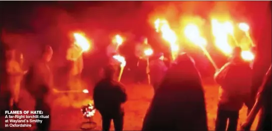  ??  ?? FLAMES OF HATE: A far-Right torchlit ritual at Wayland’s Smithy in Oxfordshir­e