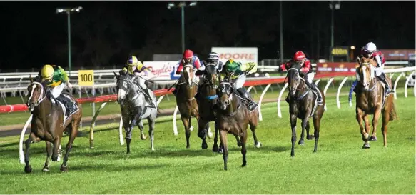  ?? Photo: Kevin Farmer ?? TOP RUN: Jockey Nozi Tomizawa guides Red Mako (inside) to win race two at Clifford Park. Red Mako trainer Tony Sears recorded a quinella in the race with Red Mako’s stablemate Explosive Evie running second.