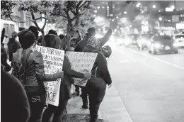  ?? STEPHEN M. KATZ/STAFF ?? Black Lives Matter 757 demonstrat­ors march along Atlantic Avenue during Saturday night’s protest in Virginia Beach.