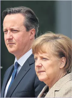  ?? Picture: GETTY ?? PRESSURED: David Cameron and Chancellor Merkel