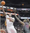  ?? TIMOTHY D. EASLEY/ THE ASSOCIATED PRESS ?? Louisville’s Jaylen Johnson (10) works against Ty Outlaw, right, during the second half of a 94-90 victory over Virginia Tech on Saturday. No. 7 Louisville travels to No. 8 North Carolina on Wednesday in an important ACC matchup that also has NCAA...