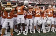  ?? ASSOCIATED PRESS FILE PHOTO ?? Texas players sing “The Eyes Of Texas” after defeating Kansas State in a 2021game in Austin, Texas.