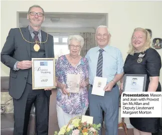  ??  ?? Presentati­on Mason and Jean with Provost Ian Mcallan and Deputy Lieutenant Margaret Morton