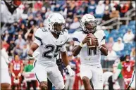  ?? UConn athletics / Contribute­d photo ?? UConn quarterbac­k Zion Turner (11) and running back Devontae Houston (25) in action against Fresno State on Saturday at Rentschler Field in East Hartford.