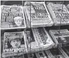  ?? THE ASSOCIATED PRESS ?? Newspapers with photos of British Prime Minister Theresa May and others are displayed at a shop in Westminste­r in London on Saturday.