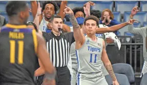  ?? JUSTIN FORD-USA TODAY SPORTS ?? Memphis Tigers guard Lester Quinones (11) reacts after scoring against the East Carolina Pirates during the second half at Fedexforum.