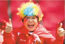  ?? Richard Heathcote / Getty Images ?? A fan of China appears excited before the team’s Group B game against Germany at Roazhon Park in Rennes, France.