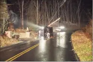  ?? Squantz Engine Company / Contribute­d photo ?? Icy roadway conditions led to an overnight crash and hours-long closure of Saw Mill Road in New Fairfield.